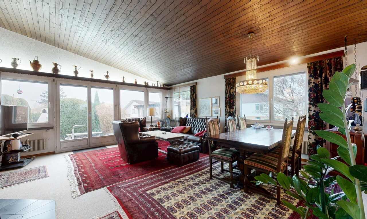 living area with vaulted ceiling, wooden ceiling, and radiator heating unit