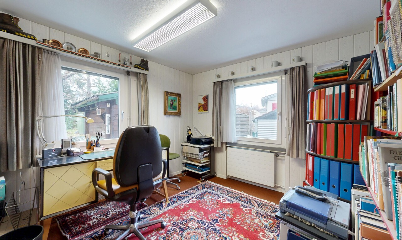 office area featuring radiator and wood finished floors