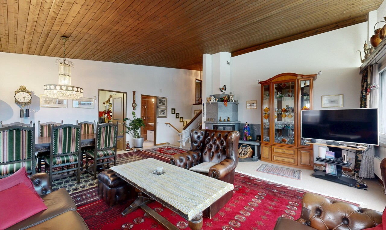 living area featuring stairway and wood ceiling