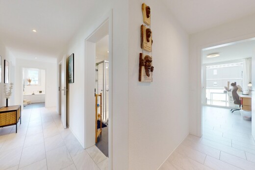 hallway featuring an office area and light tile patterned floors