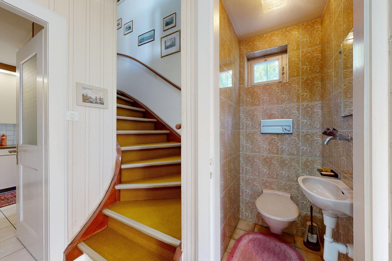 bathroom with light tile patterned floors and tile walls