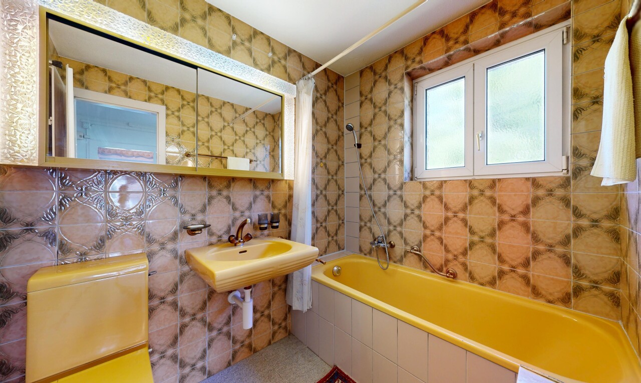 full bathroom featuring tile walls and tiled shower / bath combo