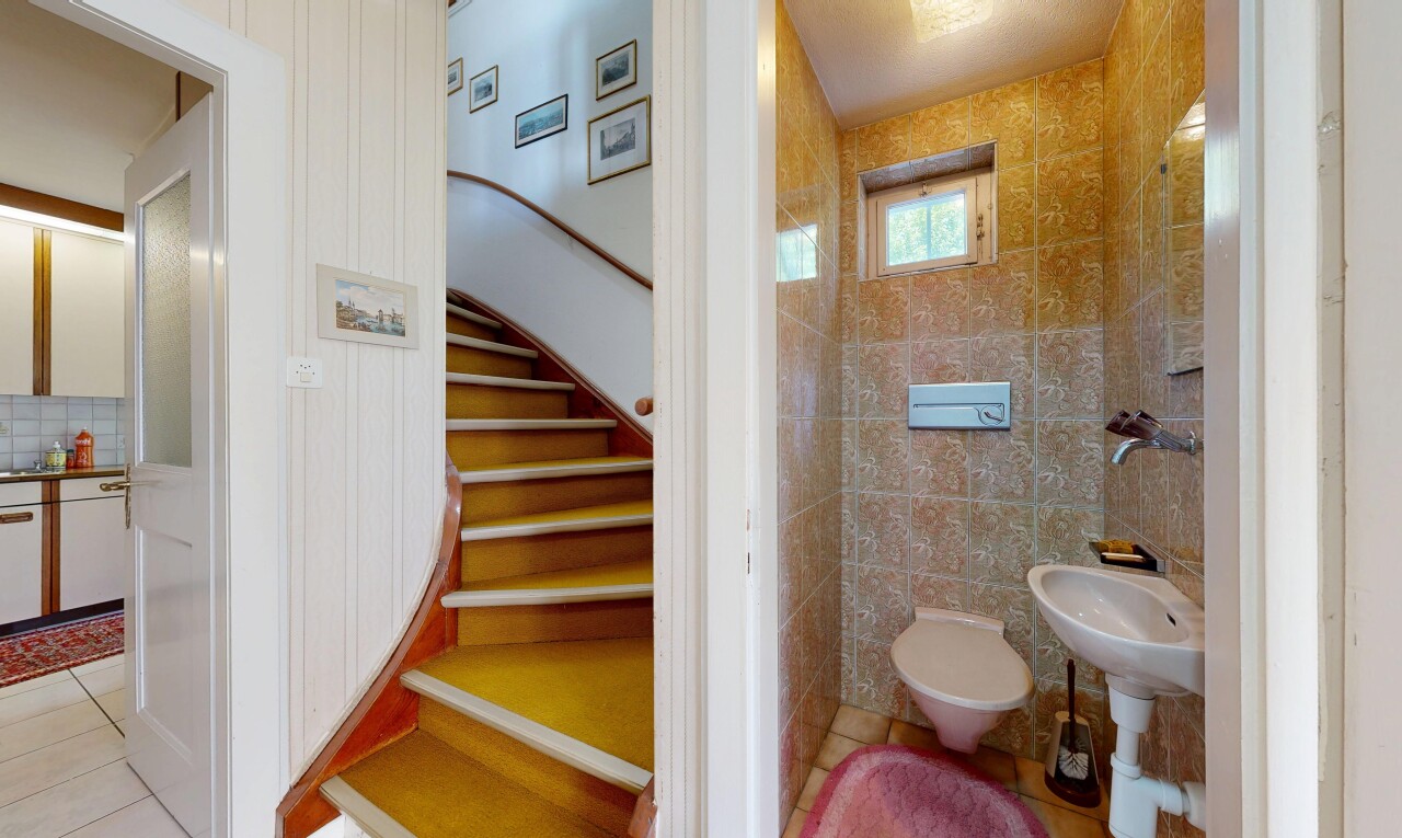 bathroom with light tile patterned floors and tile walls