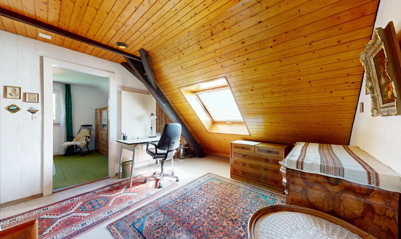office space with a vaulted wood ceiling, a skylight, and carpet