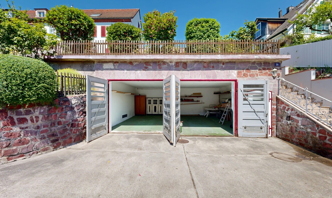 outdoor house with a garage and driveway