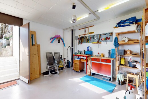 interior space with a workshop area and concrete floors