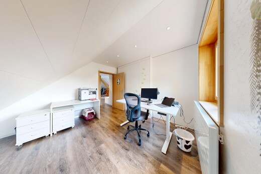 home office with wood finished floors and lofted ceiling