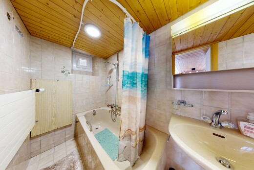 bathroom featuring tile walls, tiled shower / bath combo, wooden ceiling, and light tile patterned floors