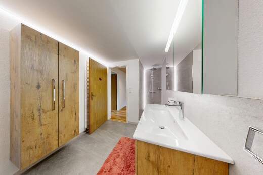 bathroom with a walk in shower and vanity
