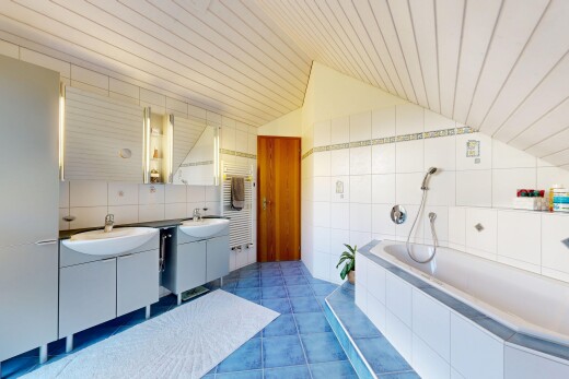 full bathroom with tile walls, a garden tub, tile patterned floors, radiator heating unit, and a vaulted wood ceiling