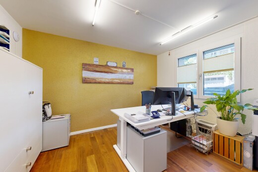 office area featuring light wood finished floors and baseboards
