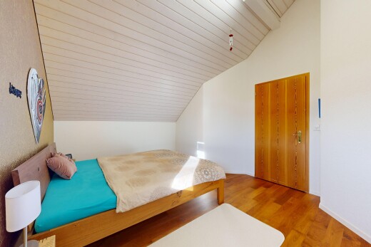 room / bedroom with light wood-style flooring and a vaulted wood ceiling