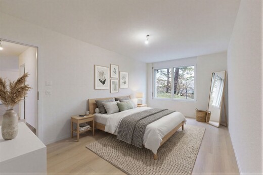 pièce vide avec drywall, cloison sèche, wood finish floor, sol en finition bois, et natural light