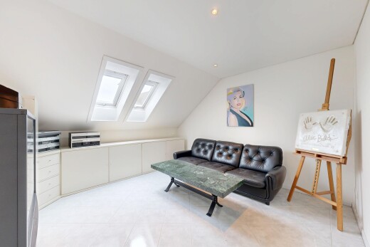 living area featuring a skylight, lofted ceiling, light tile patterned flooring, and recessed lighting