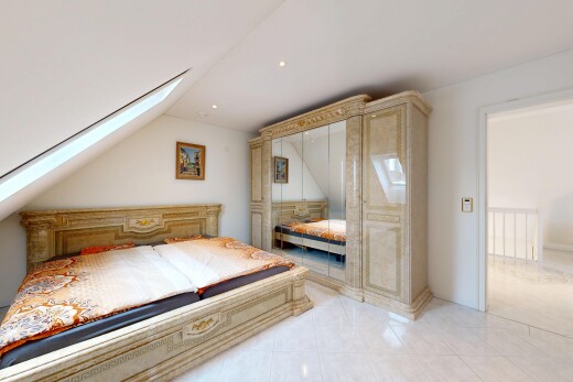 room / bedroom with vaulted ceiling, a skylight, and light tile patterned flooring