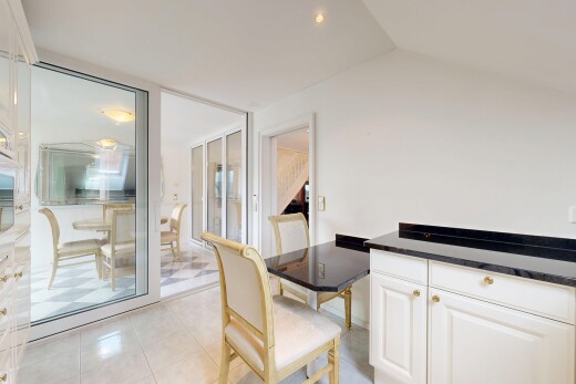 dining space featuring light tile patterned floors