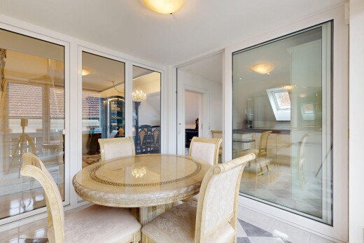 tiled dining area featuring suspended lighting