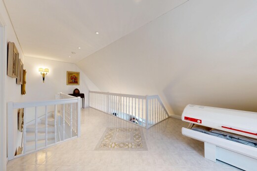 room with lofted ceiling and light tile patterned flooring