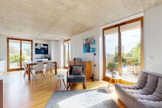 living area with expansive windows and light wood finished floors