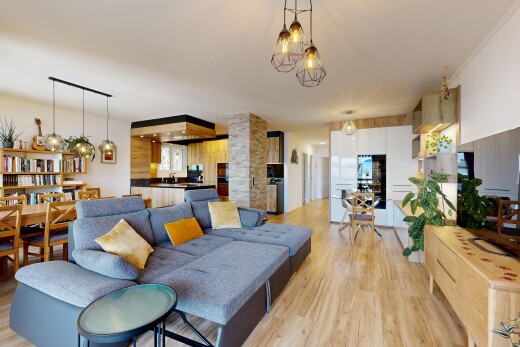 living / dining room featuring light wood-style flooring and a chandelier