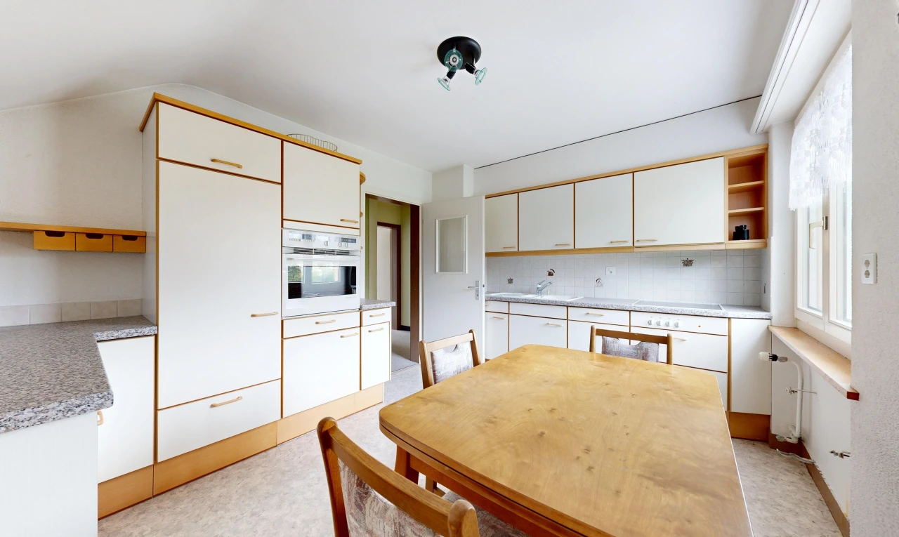 kitchen with open shelves, light countertops, and white oven