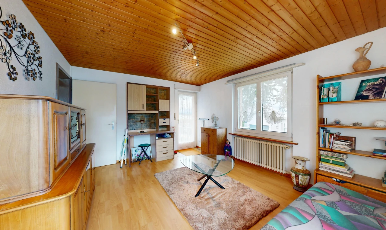 living room featuring rail lighting, wood ceiling, radiator heating unit, access to outside, and an office area