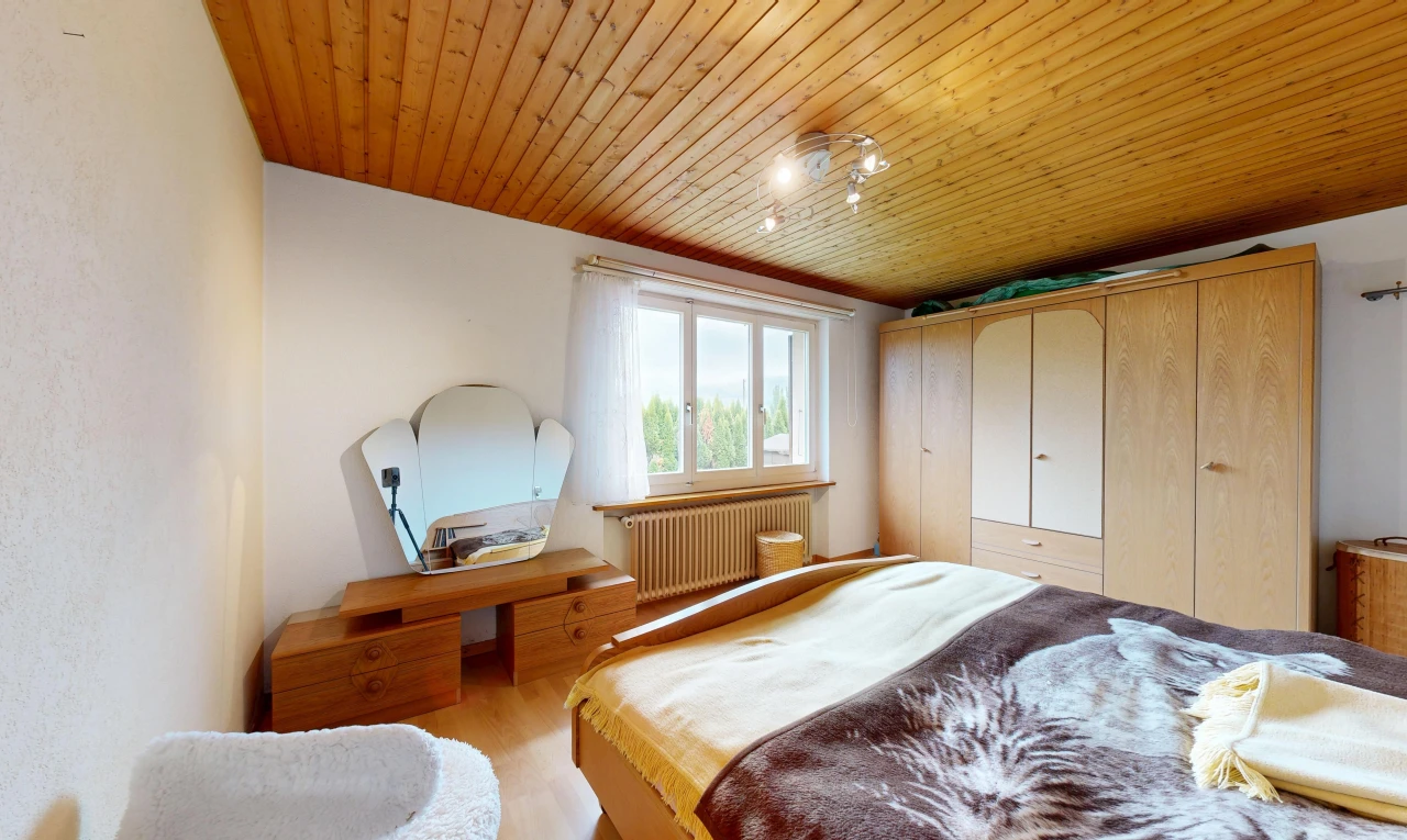 room / bedroom with rail lighting, wood ceiling, radiator, a closet, and light wood-style flooring