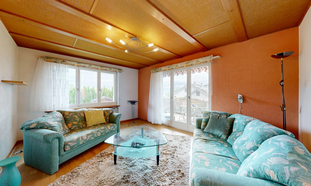 living room featuring access to outside and wood finished floors