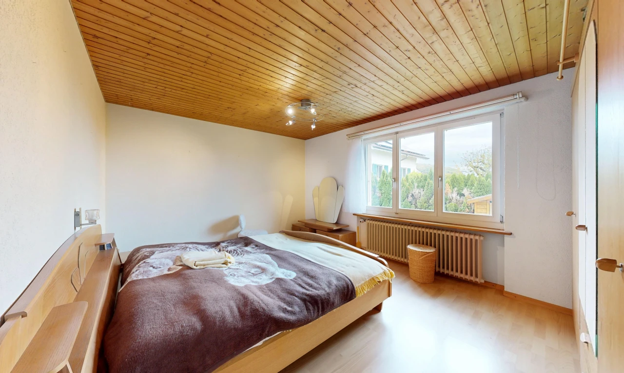 room featuring wood ceiling, radiator heating unit, and light wood-style floors