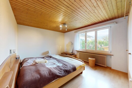 room featuring wood ceiling, radiator heating unit, and light wood-style floors