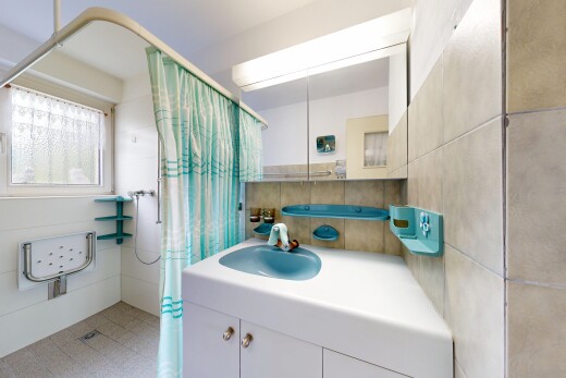 bathroom with curtained shower and vanity