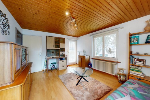 living room featuring rail lighting, wood ceiling, radiator heating unit, access to outside, and an office area