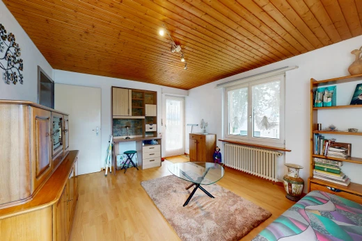 living room featuring rail lighting, wood ceiling, radiator heating unit, access to outside, and an office area