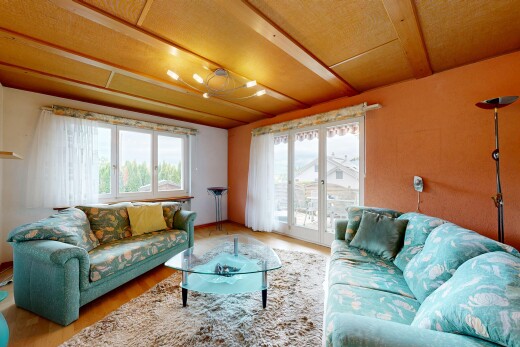 living room featuring access to outside and wood finished floors
