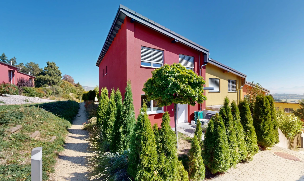 façade avec property visible, bardage en stuc, et day time