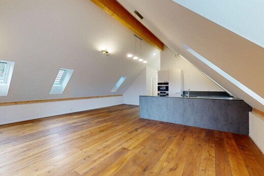 unfurnished room featuring a skylight, light wood-style floors, and lofted ceiling with beams