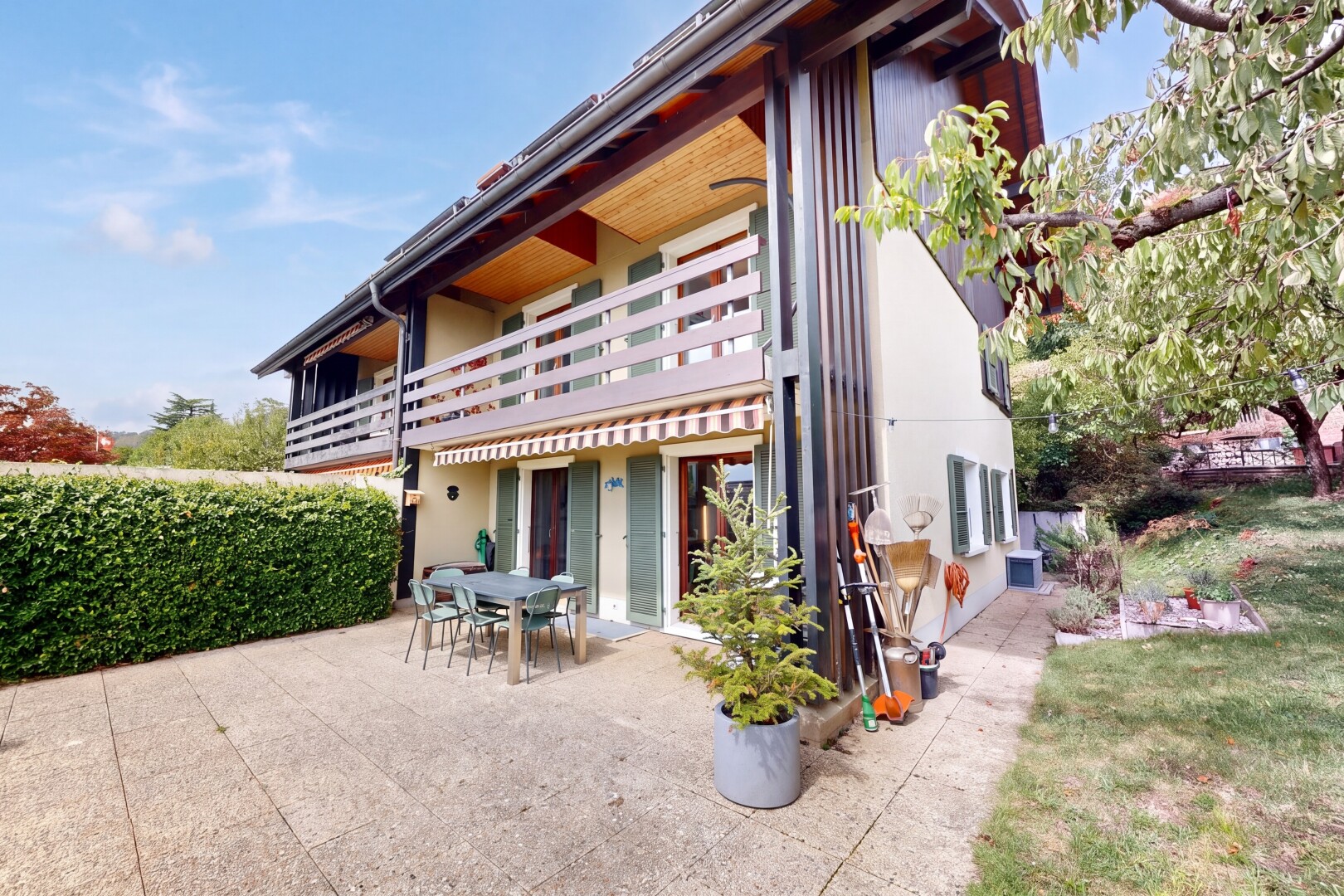 outdoor house featuring a balcony, a patio, and outdoor dining area
