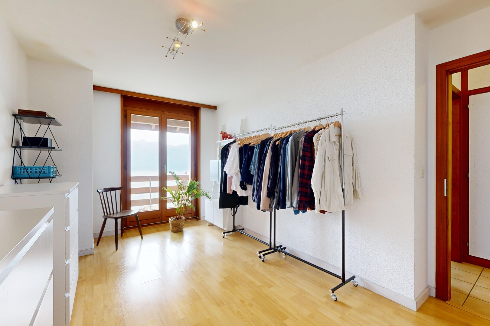 walk in closet featuring light wood-style floors