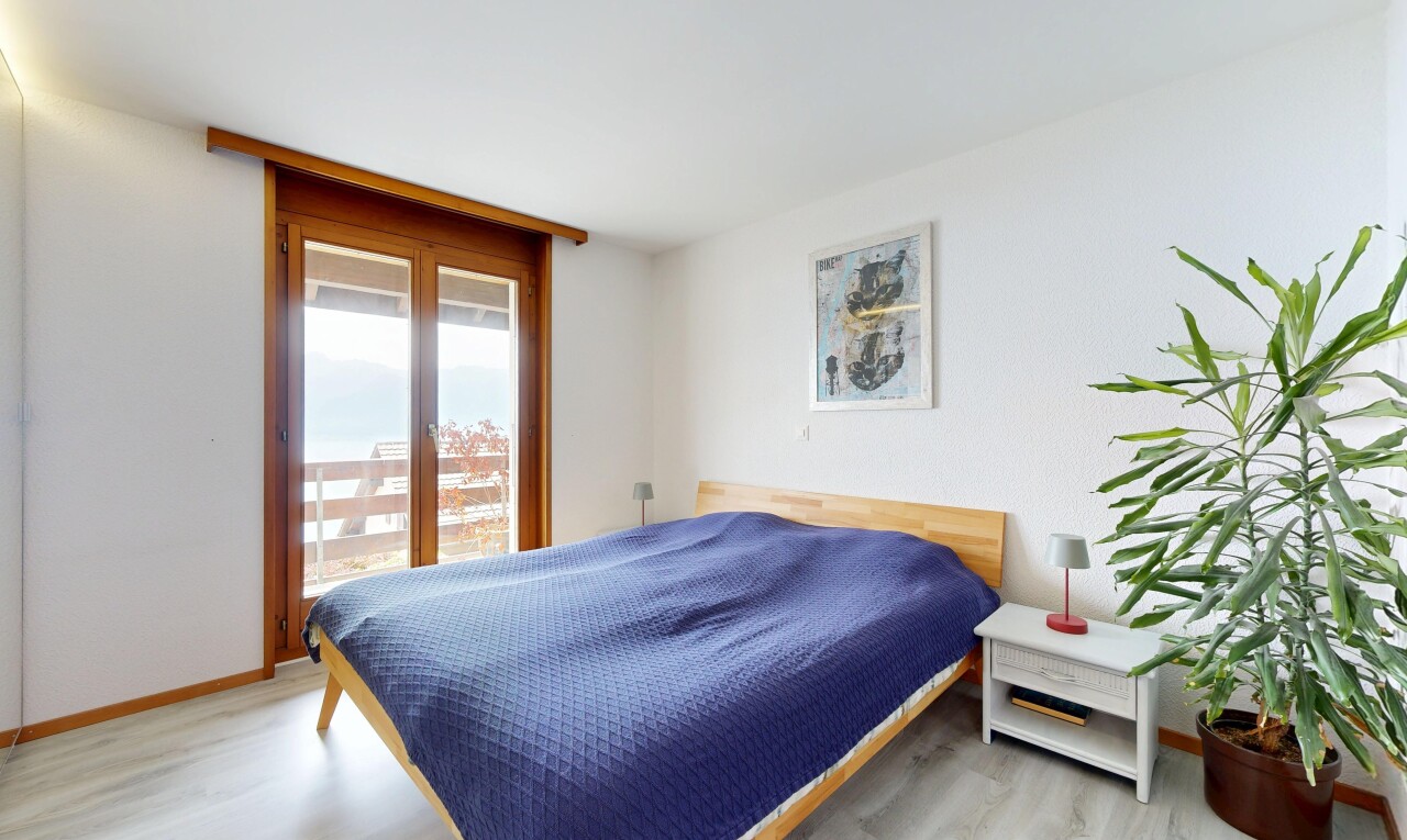 room / bedroom with light wood-type flooring and access to exterior