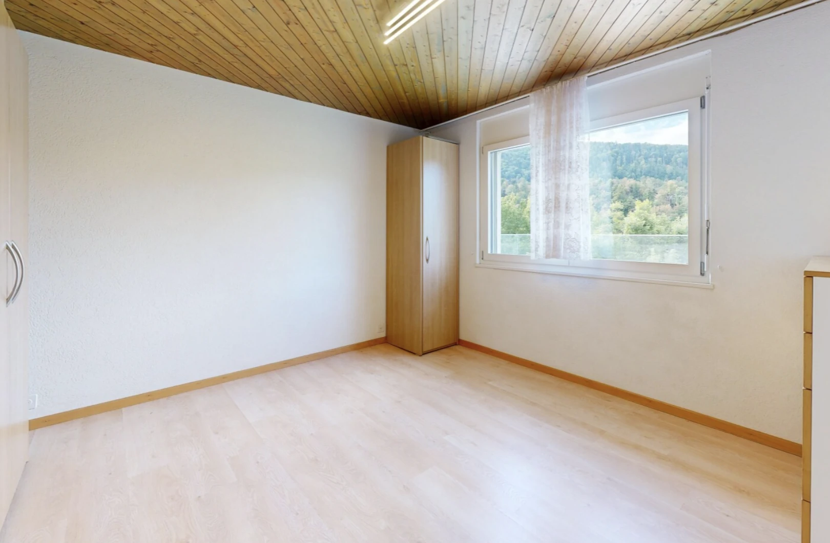 unfurnished room featuring wooden ceiling and light wood finished floors