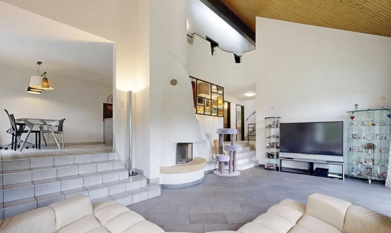 sunken living room with a vaulted wood ceiling and a large fireplace
