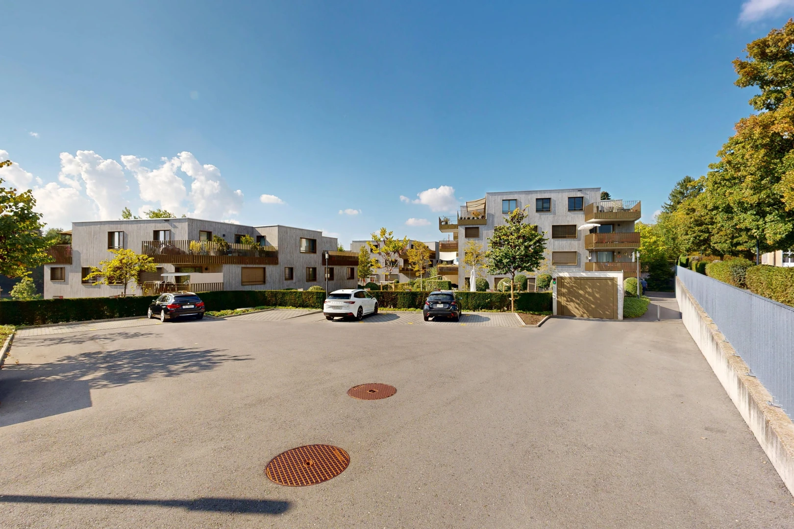 view of apartment building / complex featuring uncovered parking