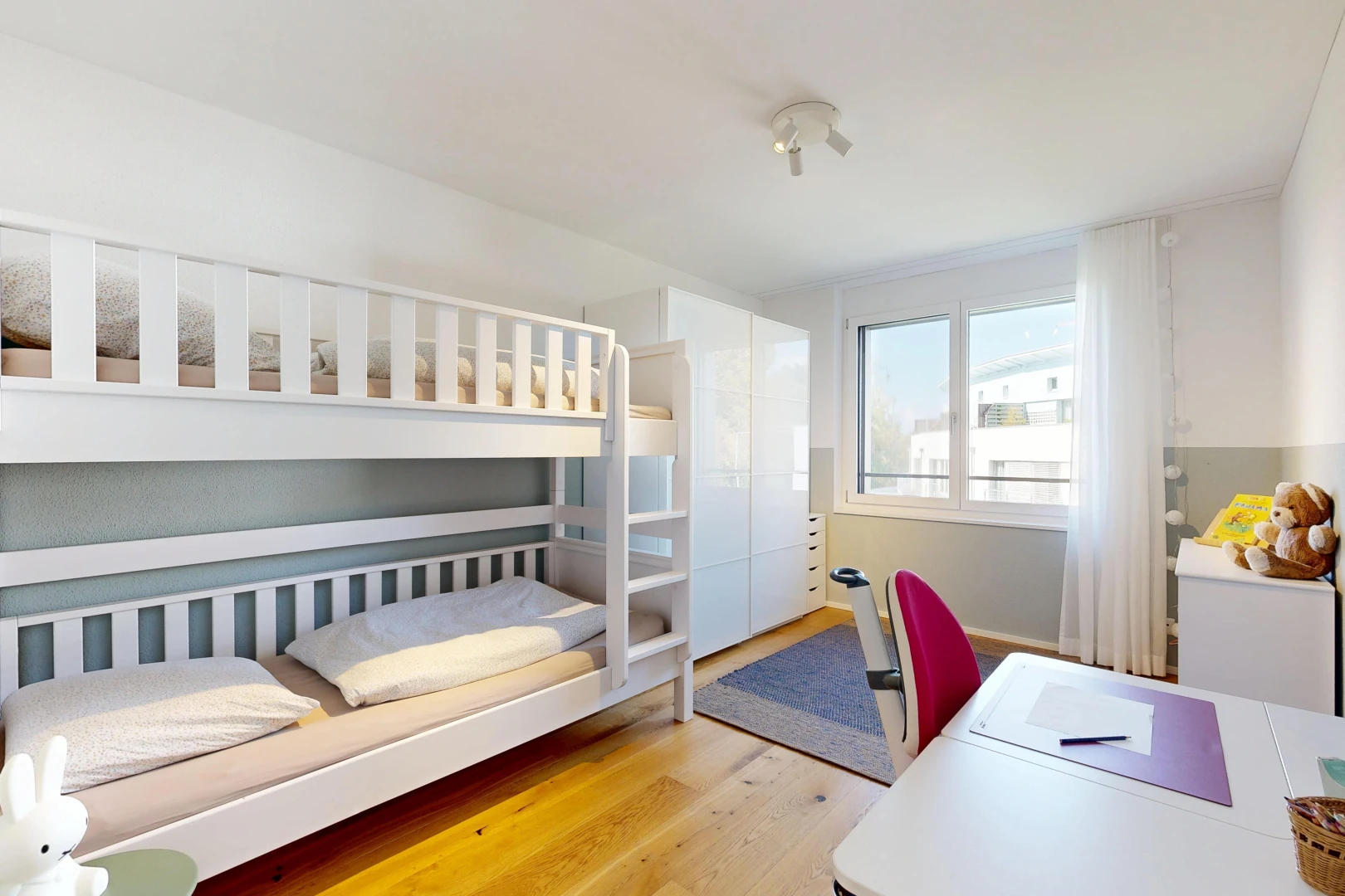 room / bedroom featuring an office area and light wood-style floors