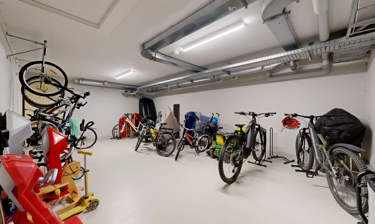 gym featuring a garage and concrete flooring