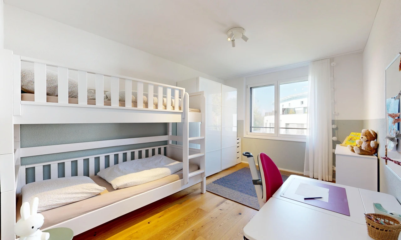 room / bedroom featuring an office area and light wood-style floors