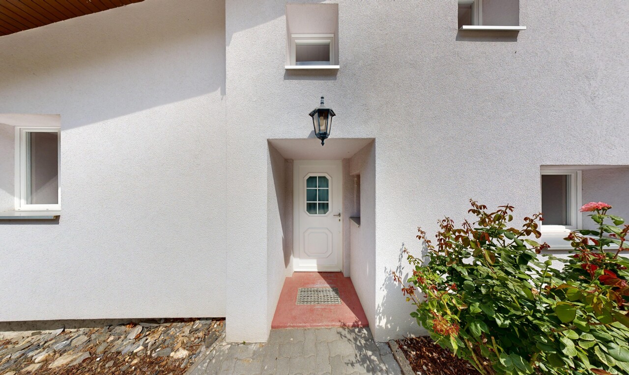 façade avec bardage en stuc et property visible
