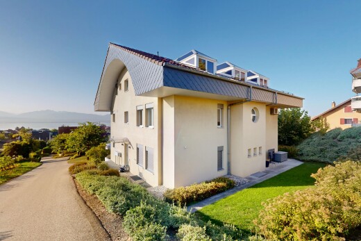 außenansicht mit stuckverkleidung, property visible, und metalldach