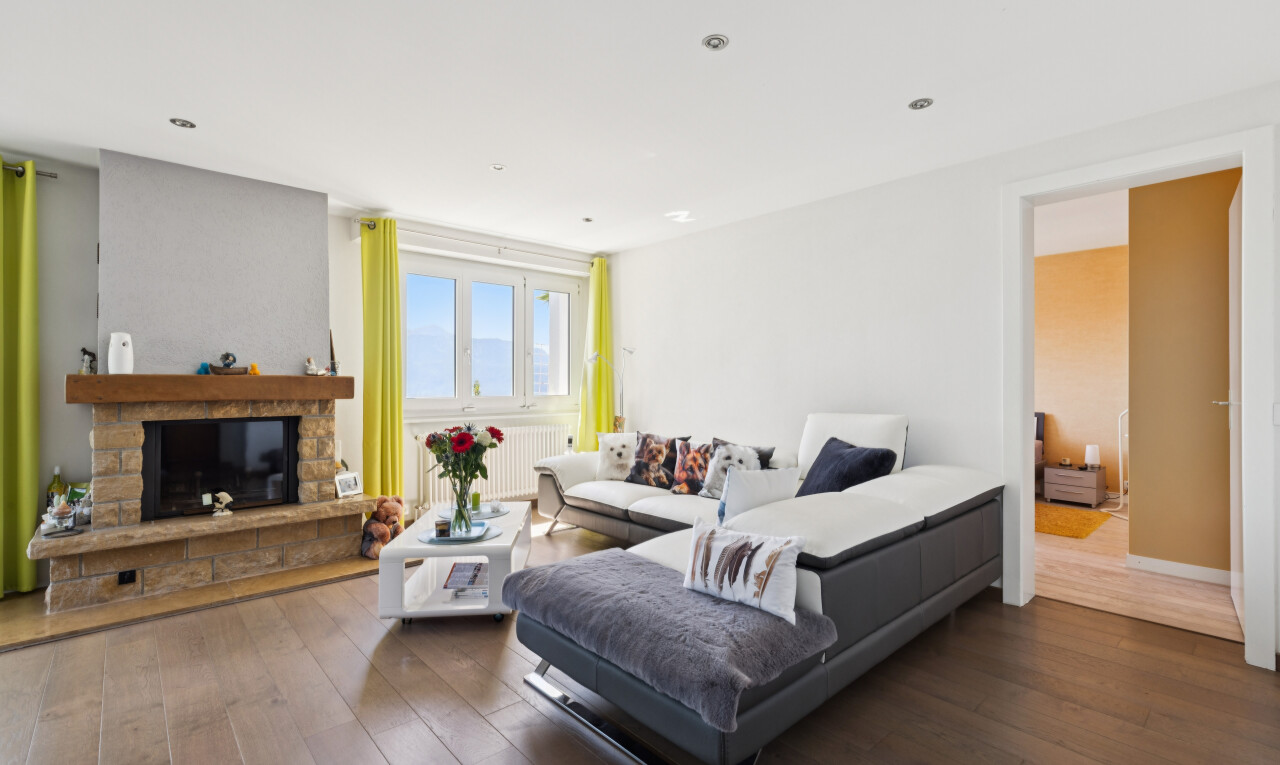 living room with a fireplace, dark wood-style floors, recessed lighting, and radiator