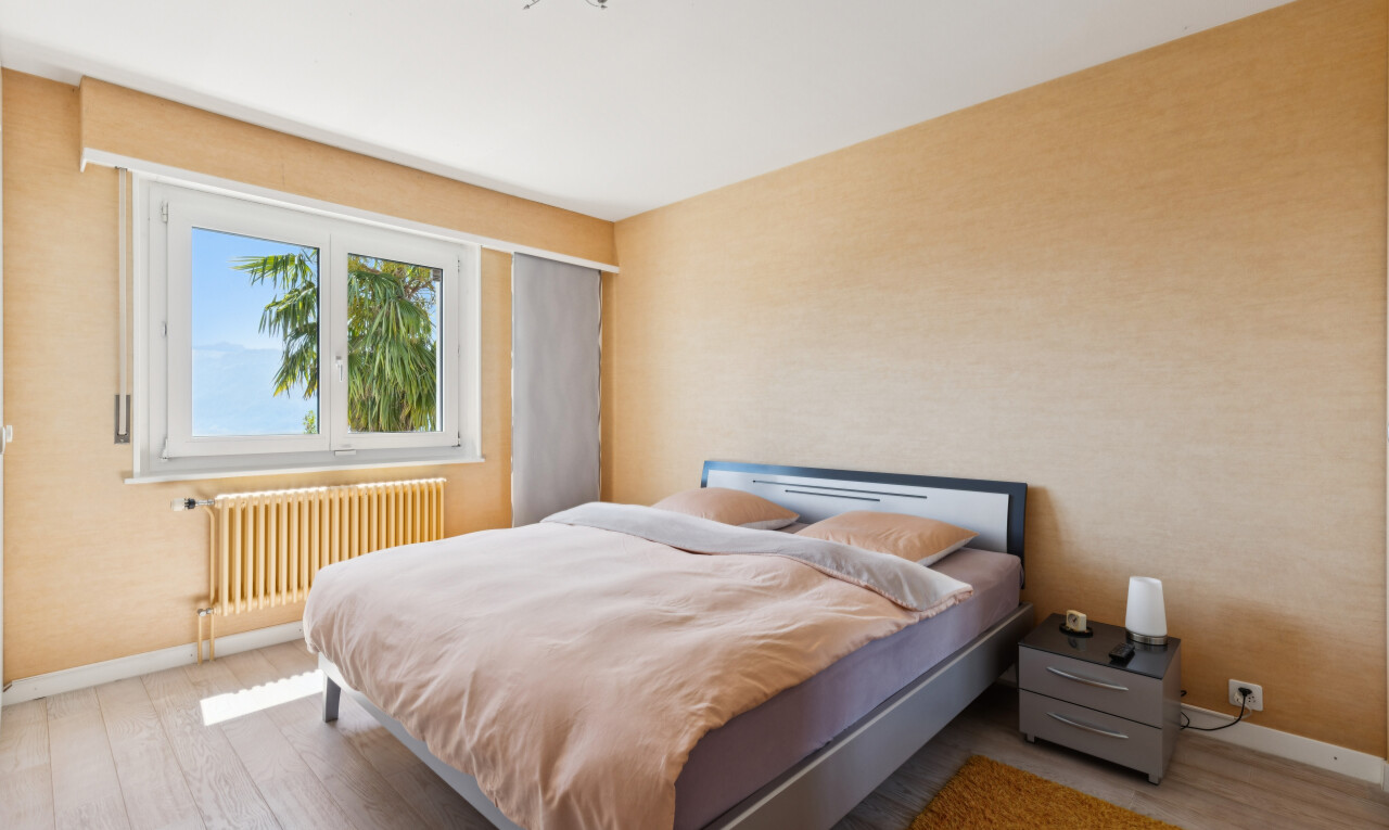 room / bedroom featuring radiator and light wood-style flooring