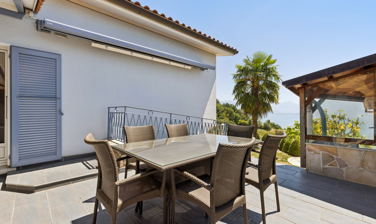 terrace featuring outdoor dining space and a patio area